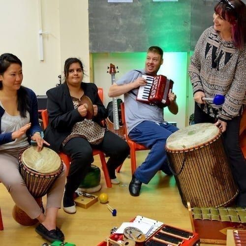 Adults in a SEND music session